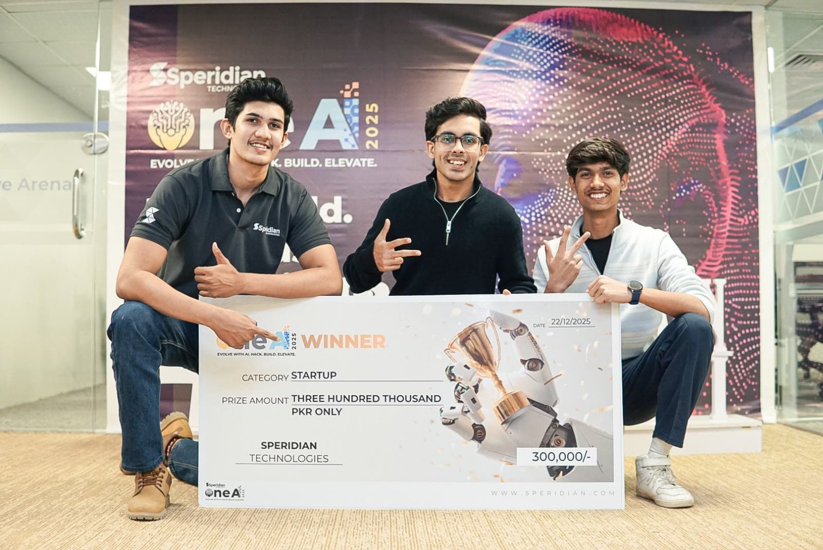 Hashir and teammates with their OneAI hackathon winner cheque